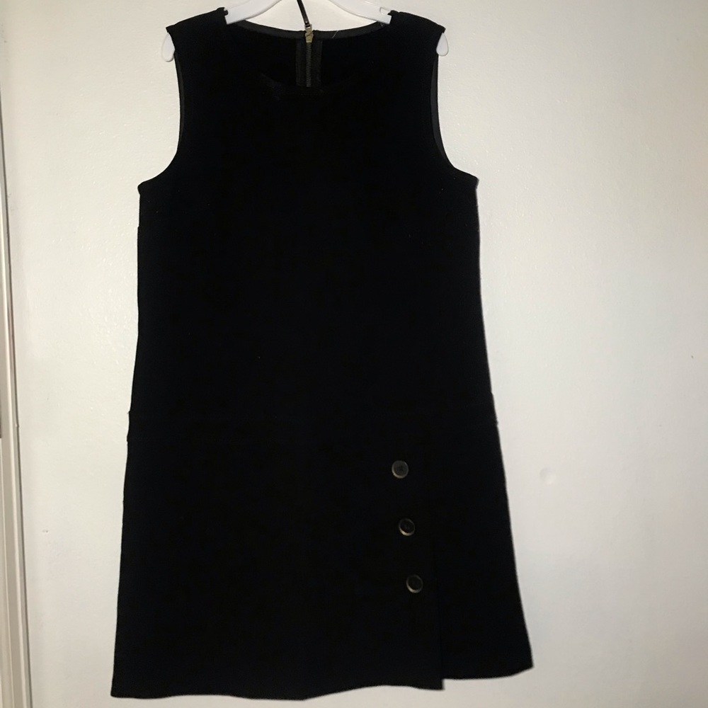 Black sleeveless top.